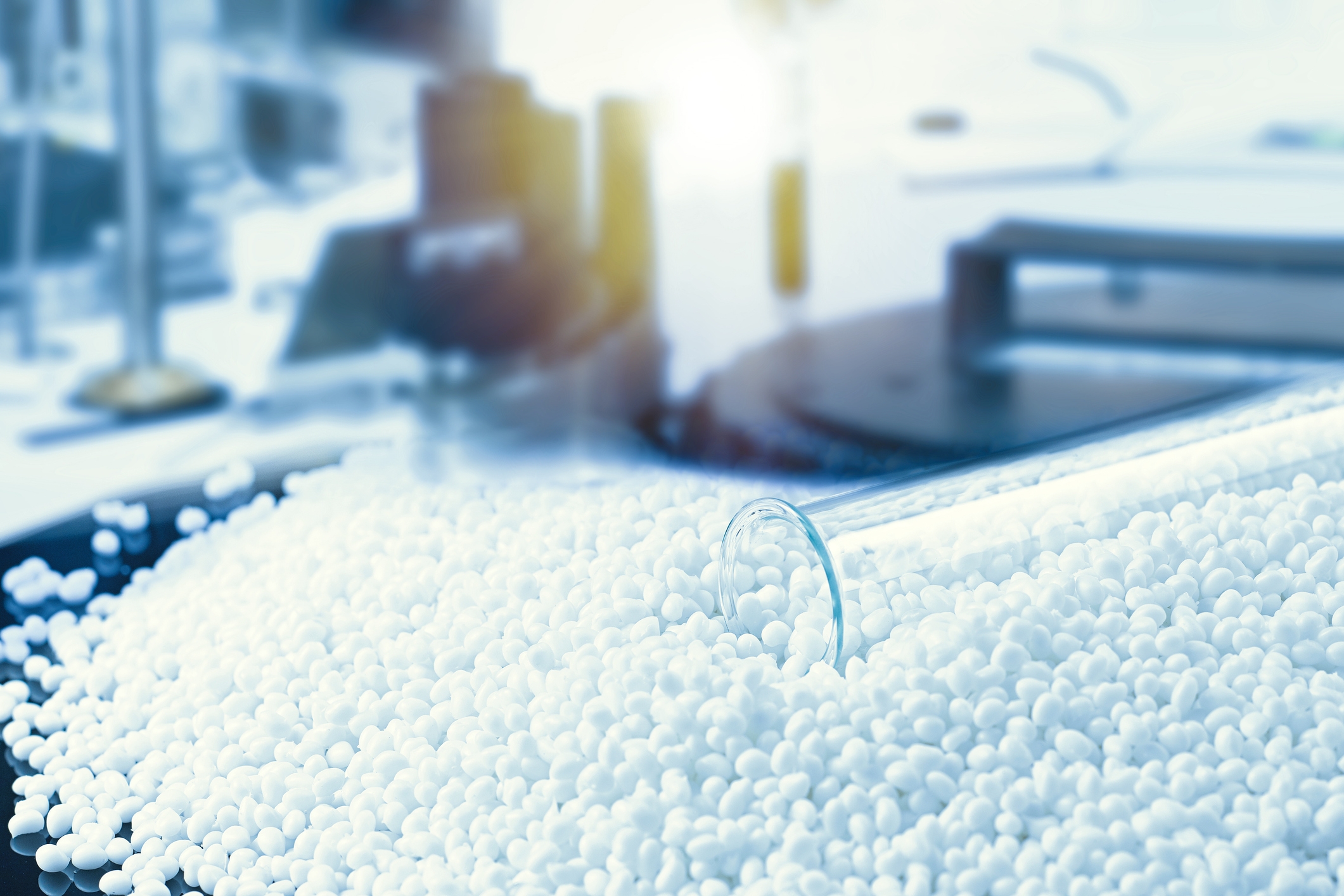 Image of plastic polymer granulate with a test tube